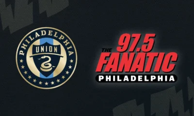 logos of the Philadelphia Union and 97.5 The Fanatic on top of a dark blue background
