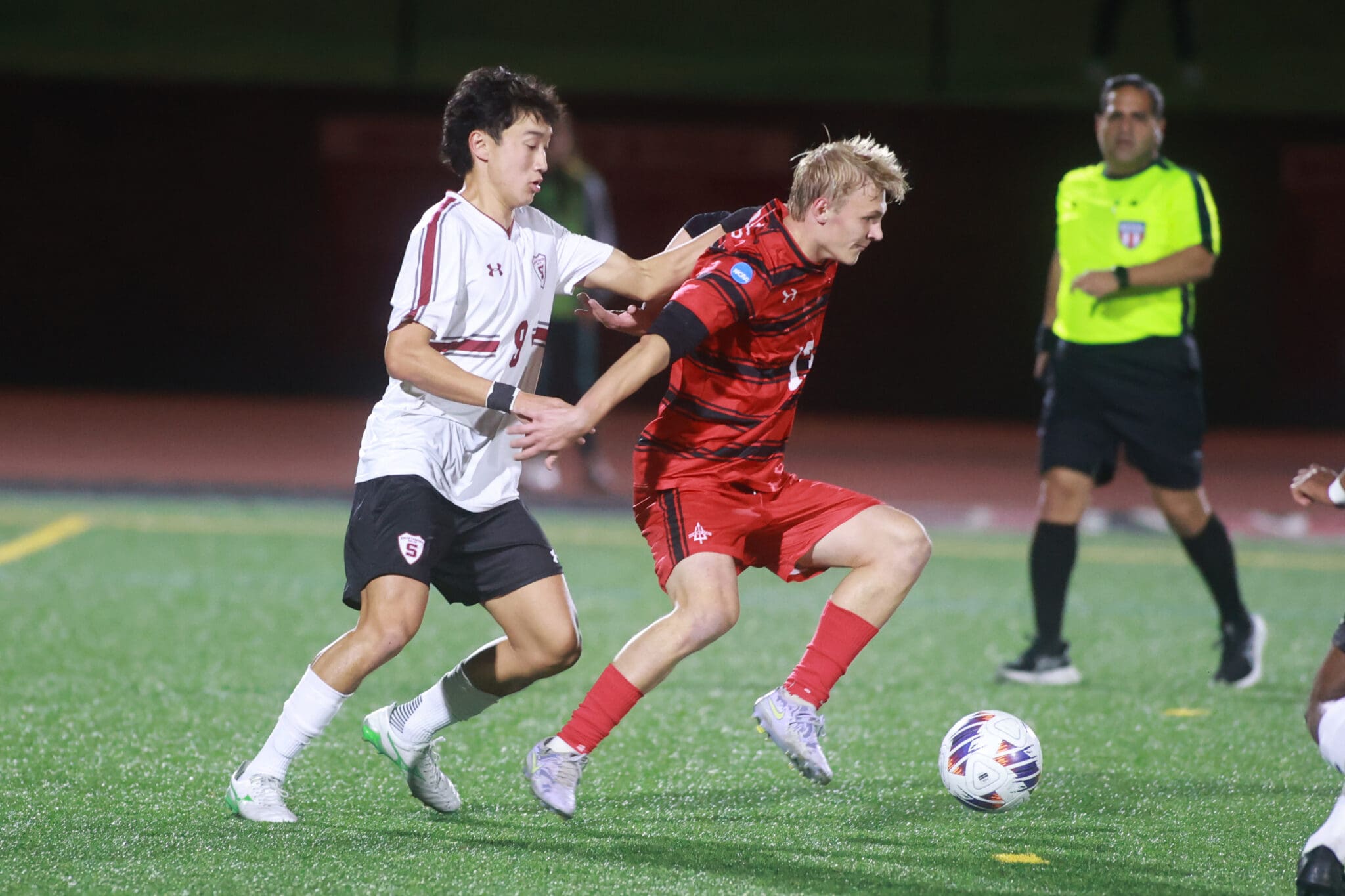 Kaden Cho and Charlie Roy battle for the ball in a Centennial Conference match between Swarthmore and Dickinson