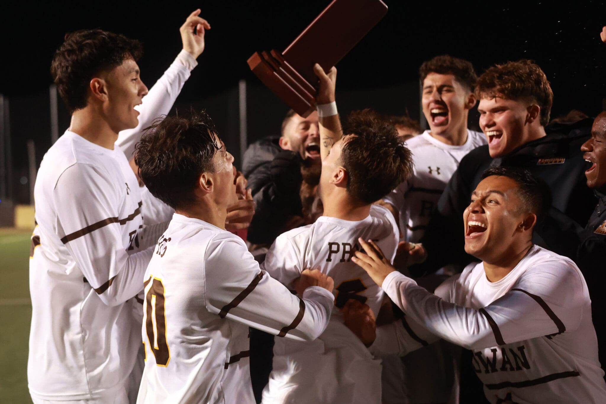 Rowan men's soccer players celebrate their second straight NJAC Championship on November 8, 2025. Photo by Matthew Ralph.
