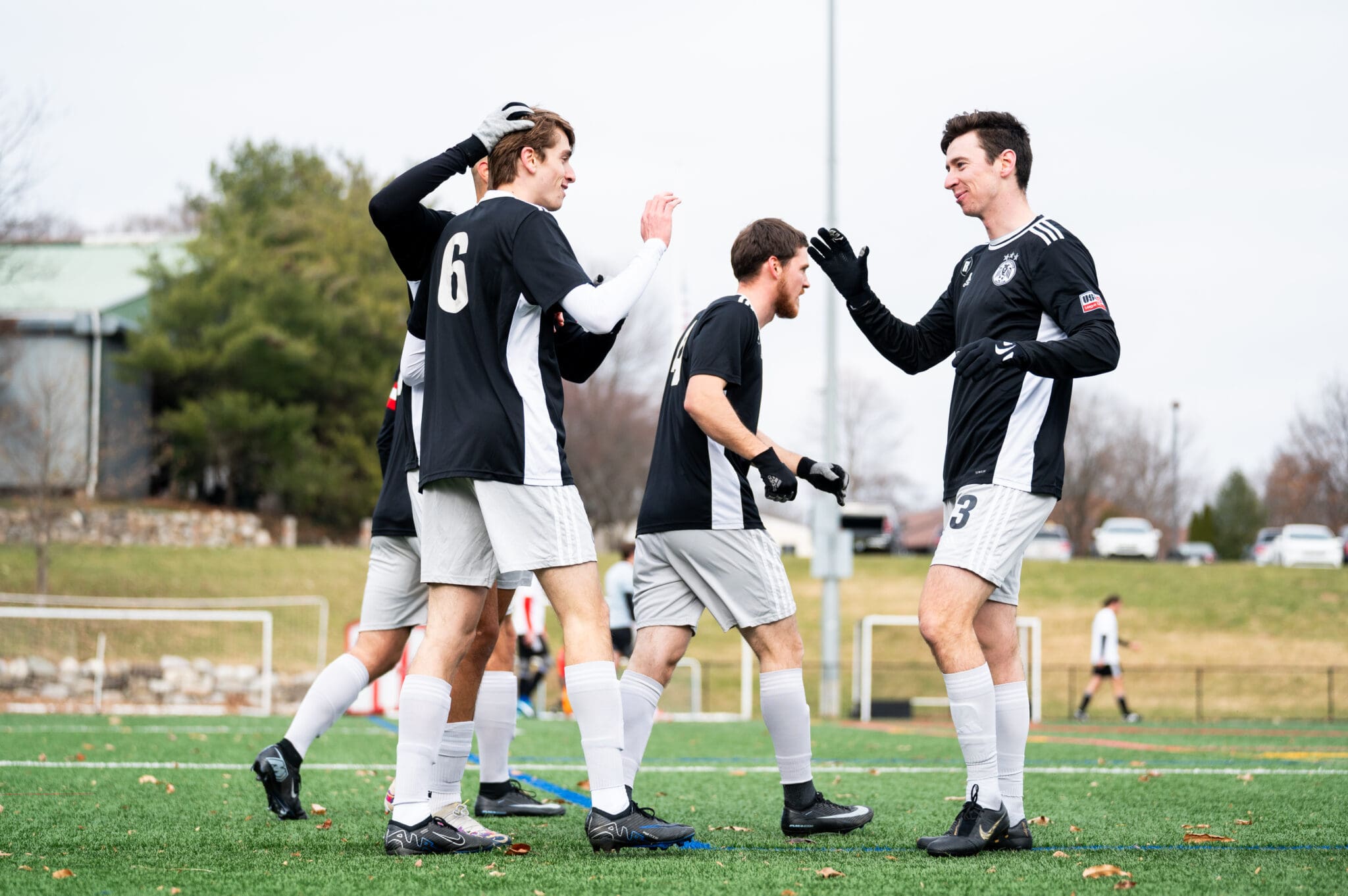 Luke Thomas and Kyle Tucker celebrate a goal for West Chester United in an EPSA Amateur Cup semifinal at Bryn Athyn College on December 7, 2025. Photo by Jack Verdeur.